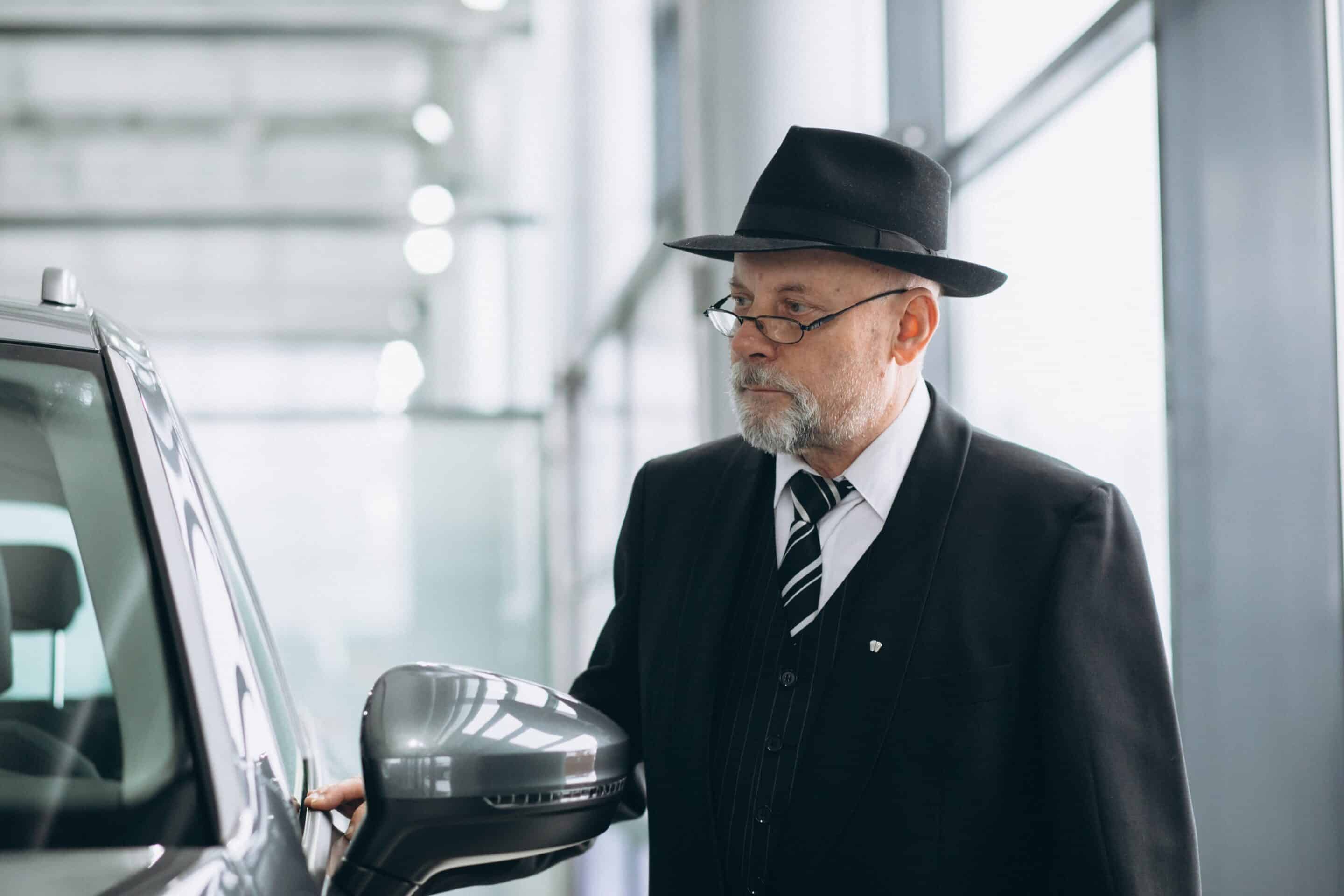 senior-man-car-showroom-choosing-car-min Mass Private Investigators