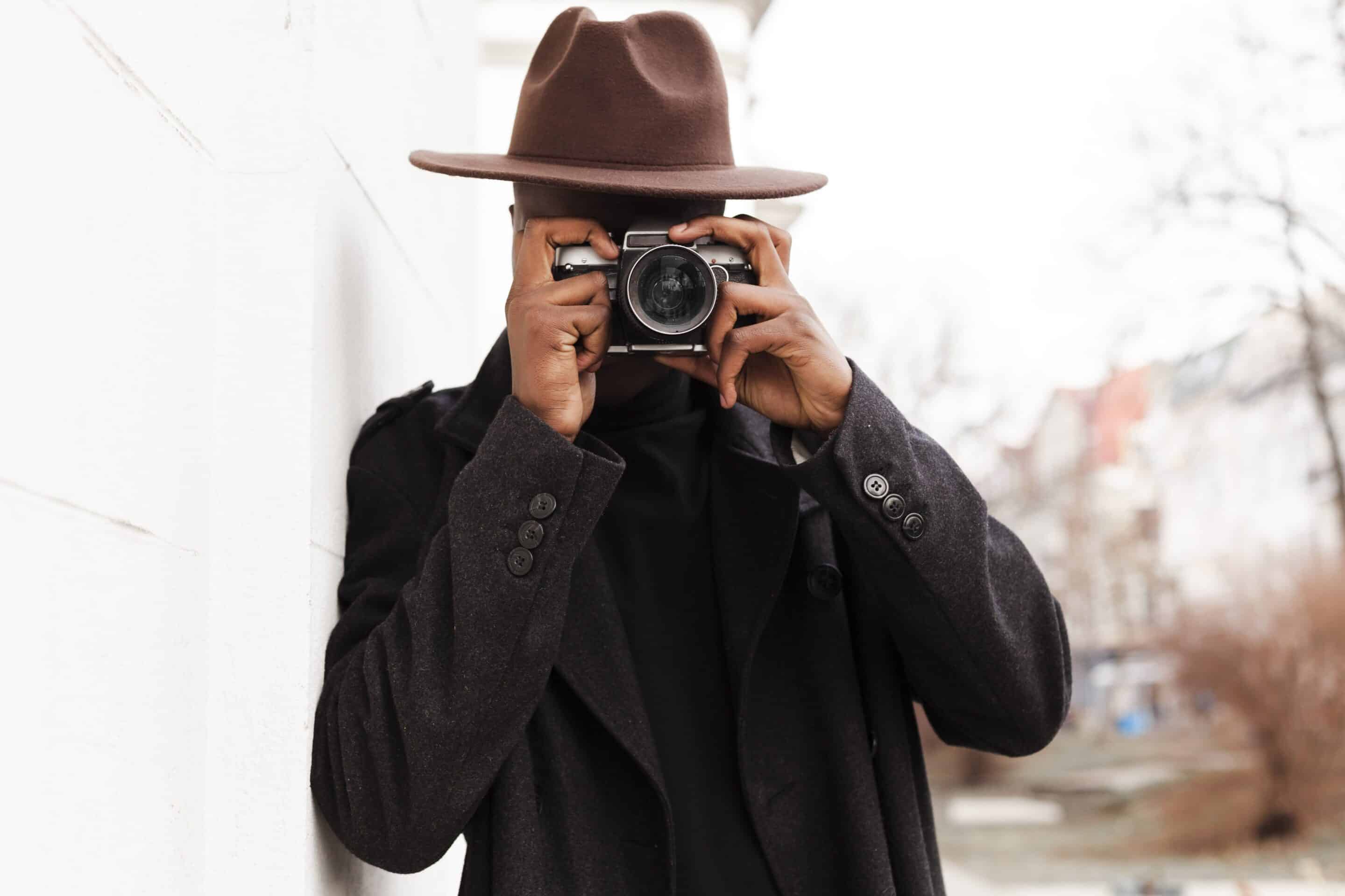 stylish-adult-male-taking-picture-with-camera-min Best PI Near Me